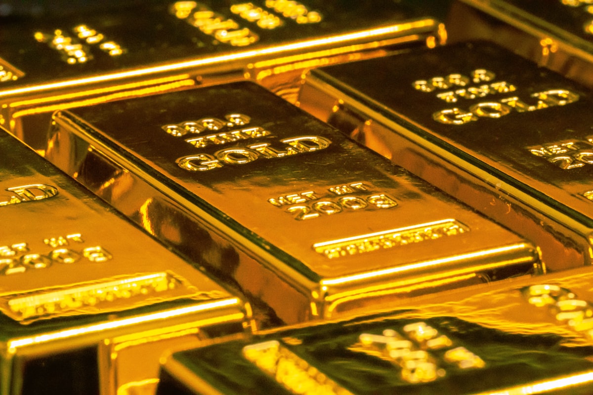 Stacked physical gold bullion bars